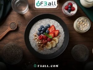 Ultra-realistic premium nutrition editorial photography for an article titled “Chia for Weight Loss: Benefits, Recipes and Safety Guide,” using the same dark, moody, luxurious visual identity as the previous images.
Create a clean overhead flat-lay composition photographed directly from above at a perfect 90-degree angle.
Place one elegant matte-black ceramic bowl of creamy chia pudding EXACTLY in the center of a normal dark walnut dining table. The bowl must rest naturally and flat on the tabletop with no serving board, raised platform, or floating appearance.
Prepare the central chia pudding with a realistic fully hydrated texture and visible swollen chia seeds. Top it neatly with fresh blueberries, sliced strawberries, raspberries, a few banana slices, crushed almonds, cinnamon, and one small mint leaf. Keep the portion moderate, balanced, and practical.
Arrange three small recipe variations around the central bowl while keeping them clearly secondary:
A small transparent glass of berry chia pudding with plain Greek yogurt.
A compact jar of overnight oats mixed with hydrated chia seeds.
A clear glass of lemon water containing a small amount of fully soaked chia seeds.
Include practical safety and preparation elements around the composition:
A small wooden measuring spoon containing a controlled portion of dry chia seeds.
A transparent glass bowl showing chia seeds fully soaked in water.
A clear glass of plain water.
A small jug of unsweetened milk.
A bowl of plain Greek yogurt.
Rolled oats, almonds, walnuts, berries, lemon halves, and cinnamon sticks.
Position the dry chia seeds far from the finished drinks and place the hydrated chia mixture closer to the central bowl, subtly communicating proper soaking and measured use without text, warning symbols, or medical graphics.
Keep the arrangement clean, organized, realistic, and uncluttered. The central chia-pudding bowl must remain the single dominant focal point and occupy approximately 40–45% of the frame.
Create a sophisticated dark tabletop atmosphere with rich walnut wood grain, deep charcoal-black tones, dark emerald-green fabric accents, subtle botanical details, and refined ceramic and glass textures.
Use dramatic directional studio lighting from the upper left, rich controlled shadows, soft highlights on the hydrated chia texture, realistic condensation on the glasses, fresh moisture on the berries, crisp ingredient details, and premium nutrition-magazine styling.
Perfect top-down photography, symmetrical balanced composition, photorealistic DSLR food photography, macro-level detail, 8K, HDR, razor-sharp central bowl, subtle depth of field toward the outer edges, natural charcoal, emerald-green, walnut, berry-red, and creamy neutral color palette, wide 16:9 website hero banner.
No people.
No visible faces.
No human hands.
No human body.
No exposed skin.
No guaranteed weight-loss results.
No medical claims.
No readable text.
No logos.
No watermark.